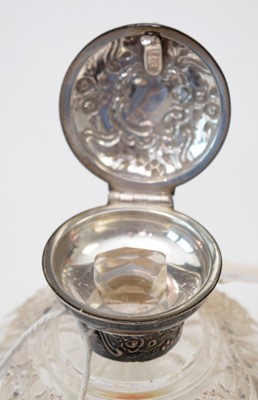 Lot 214 - Silver-mounted cut-glass scent bottle.
