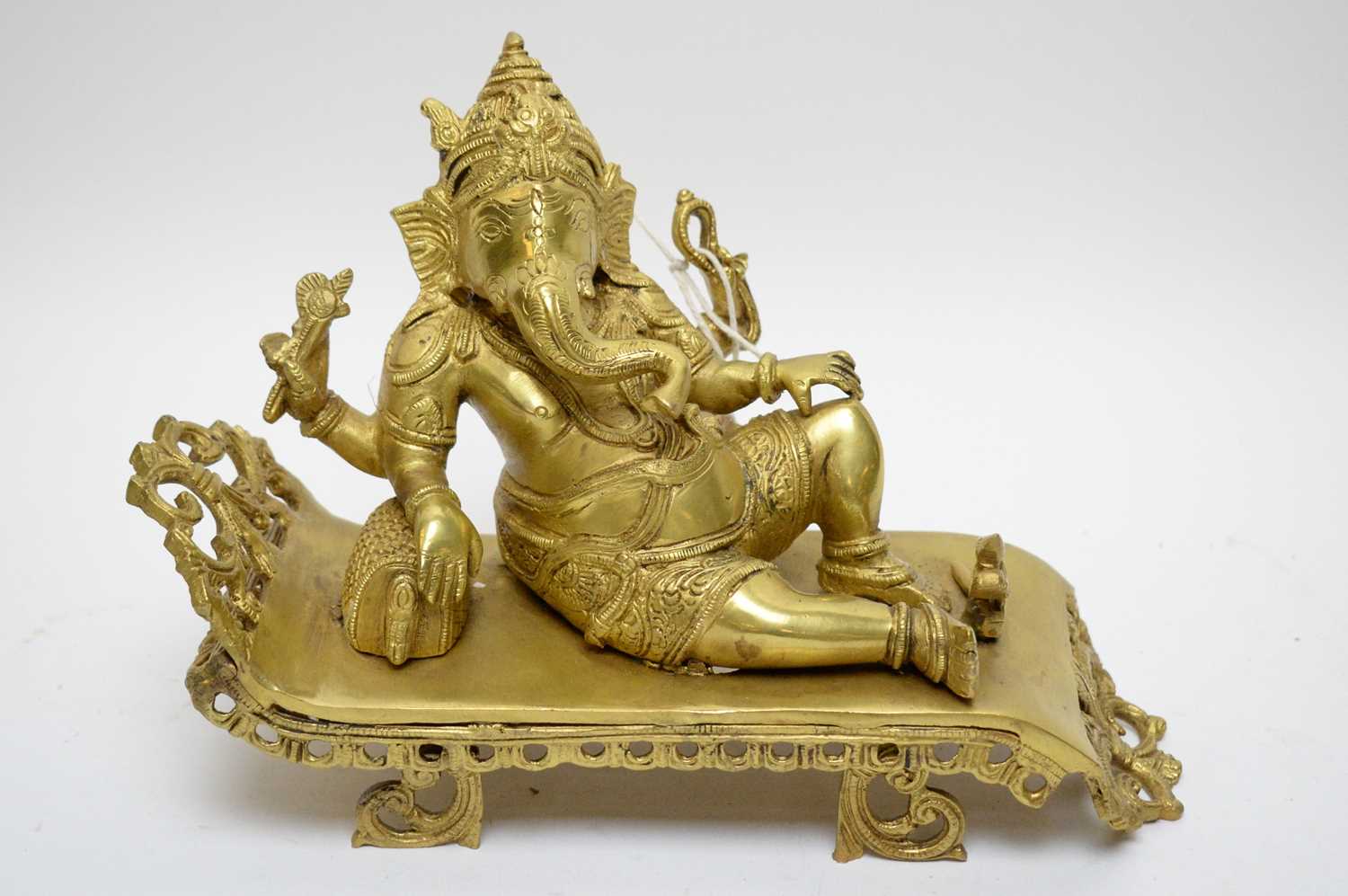 Lot 397 - Modern Indian gilt brass figure of Ganesh.