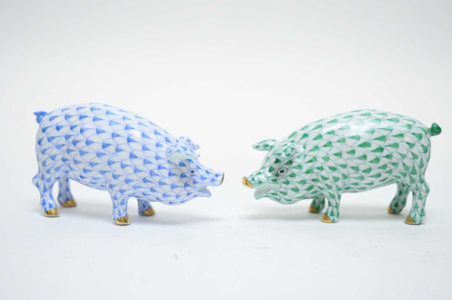 Lot 384 - Two Herend pig ornaments.