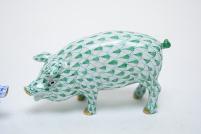 Lot 384 - Two Herend pig ornaments.