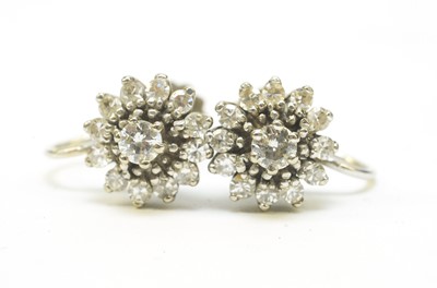 Lot 75 - A pair of diamond cluster earrings