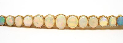 Lot 77 - An opal bar brooch