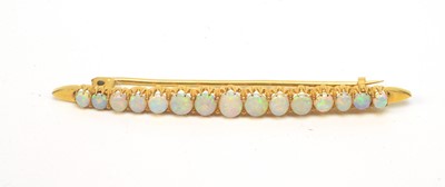 Lot 77 - An opal bar brooch