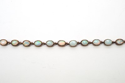 Lot 81 - A Gilson synthetic opal bracelet and drop earrings.