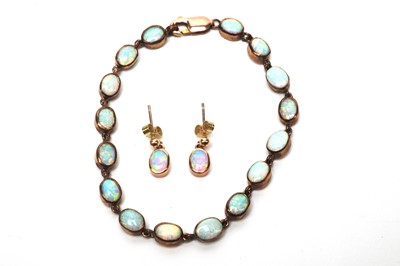 Lot 81 - A Gilson synthetic opal bracelet and drop earrings.