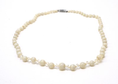 Lot 82 - A white opal bead and crystal necklace.