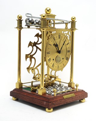 Lot 771 - A modern lacquered brass spherical weight clock.