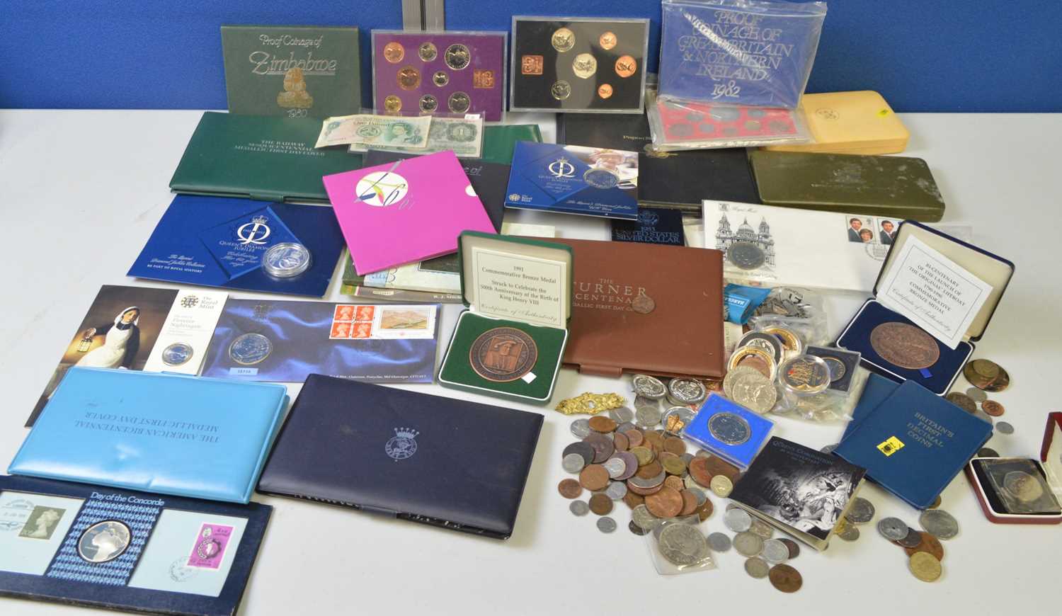 Lot 195 - A selection of proof sets, coin covers and...