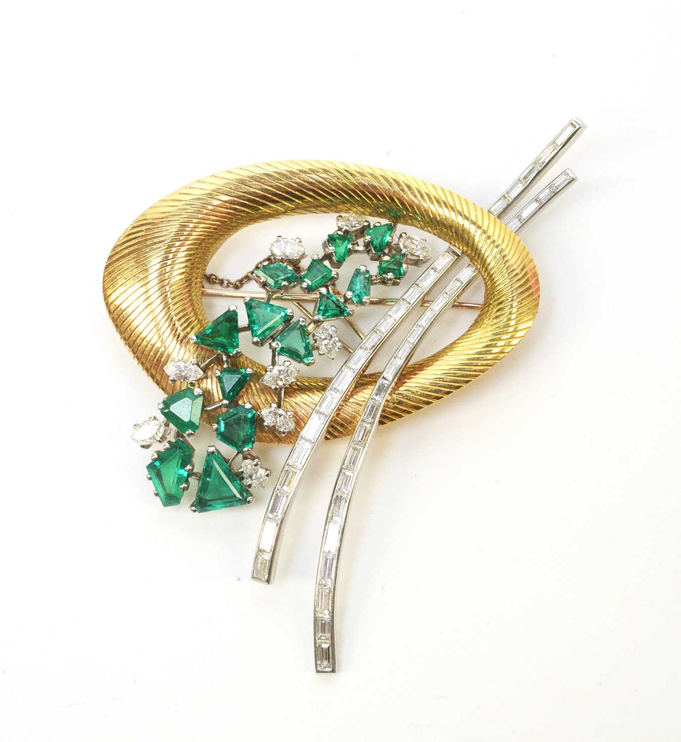 Lot 2 - An Art Deco diamond, emerald and yellow metal brooch.