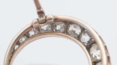 Lot 1 - A diamond crescent brooch.