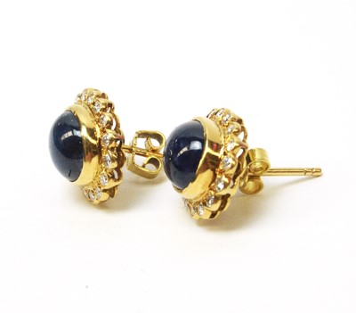 Lot 5 - A pair of sapphire and diamond cluster earrings.