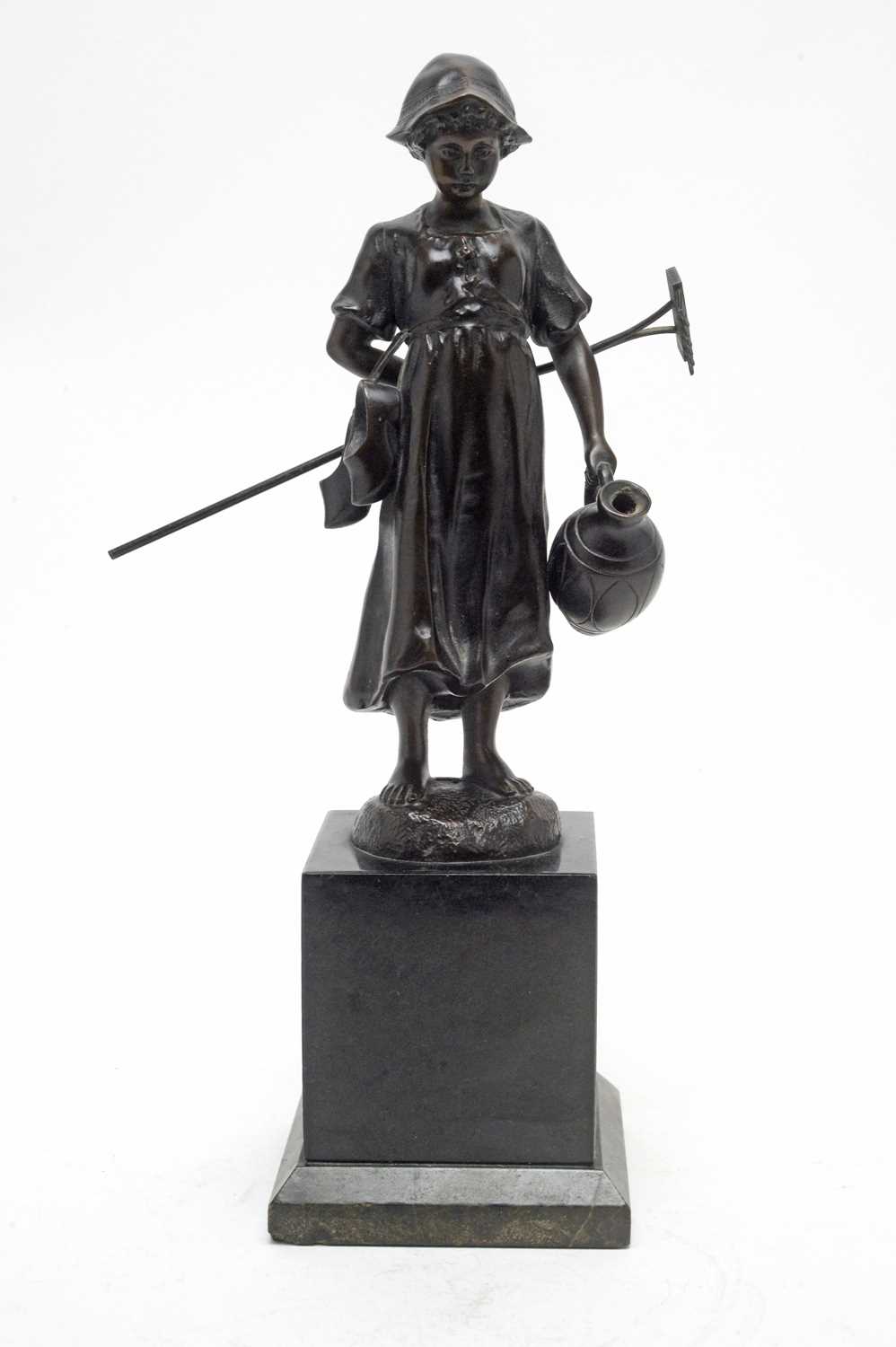 Lot 435 - E. Fülleorn: a brown patinated bronze model of a Dutch girl.