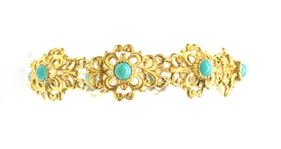Lot 84 - A turquoise set 9ct yellow gold bangle