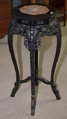 Lot 884 - Chinese carved hardwood octagonal jardiniere stand.