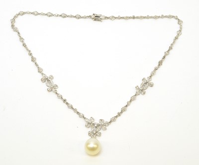 Lot 88 - A diamond necklace with cultured pearl drop.