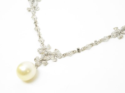 Lot 31 - A diamond necklace with cultured pearl drop.