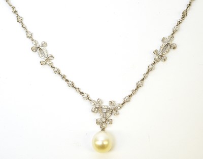 Lot 31 - A diamond necklace with cultured pearl drop.