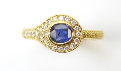 Lot 89 - A sapphire and diamond dress ring.