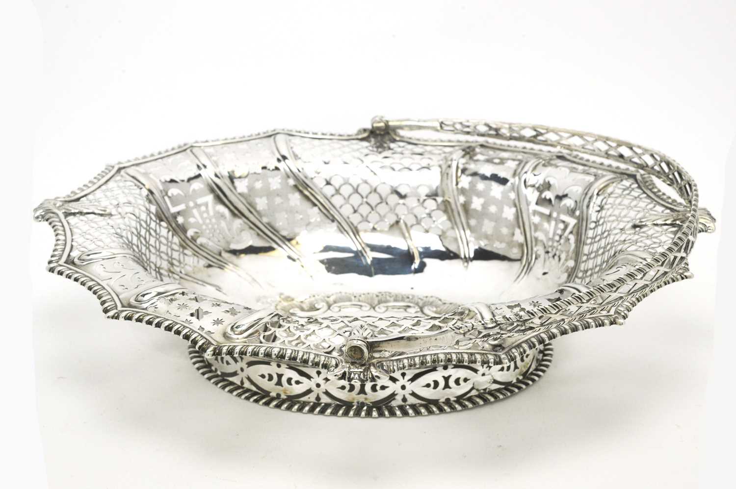 Lot 146 - A George III silver basket.