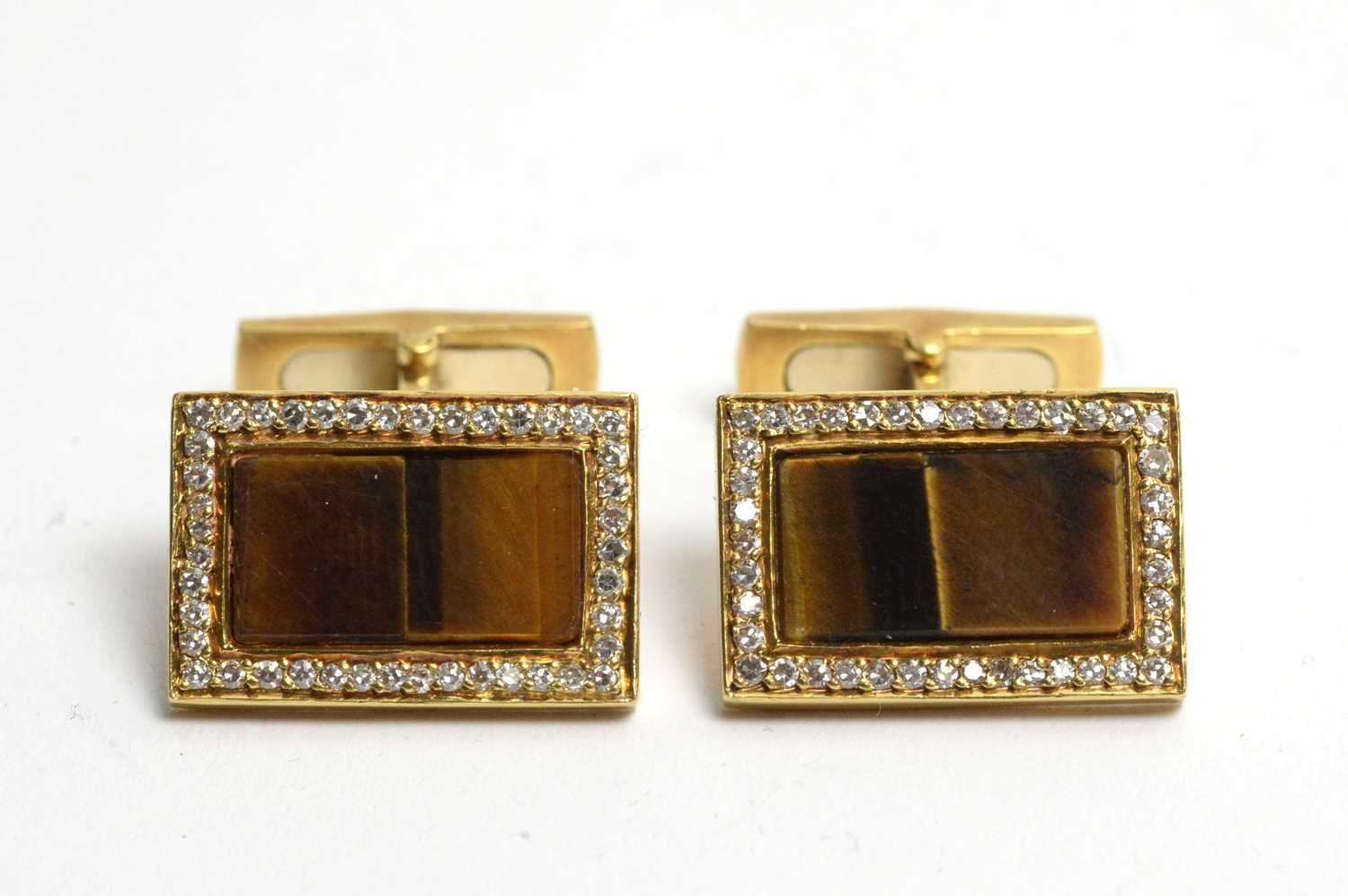 Lot 96 - A pair of tiger's-eye and diamond cufflinks