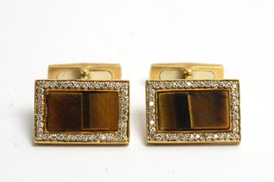 Lot 96 - A pair of tiger's-eye and diamond cufflinks