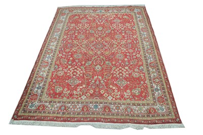 Lot 324 - A Tabriz carpet.