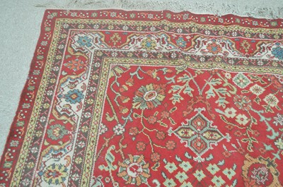 Lot 324 - A Tabriz carpet.