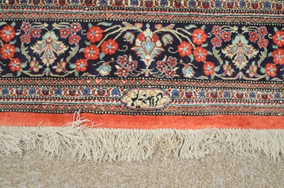 Lot 635 - A modern silk Persian rug.