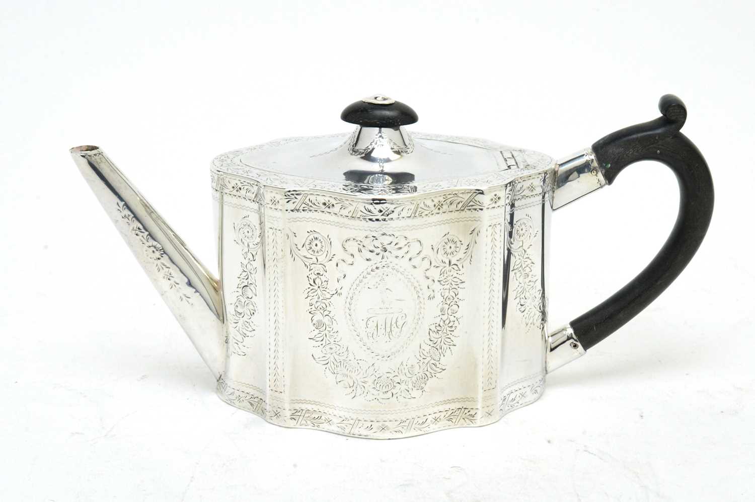 Lot 143 - A George III silver teapot.