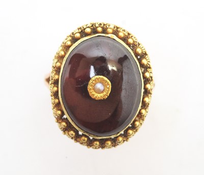Lot 97 - A garnet and seed pearl ring