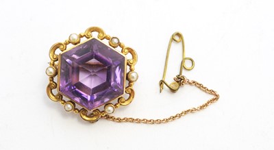 Lot 98 - An Edwardian amethyst, seed pearl and yellow metal brooch.