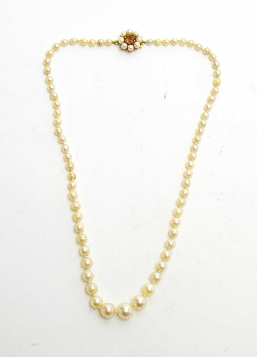 Lot 105 - A single row pearl necklace.