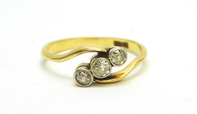 Lot 108 - A three-stone diamond ring.