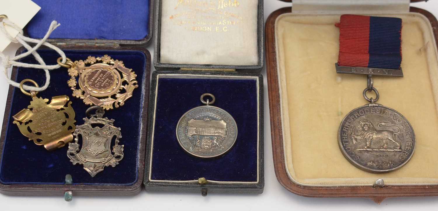 Lot 206 - Silver medallions, silver and gold fobs.