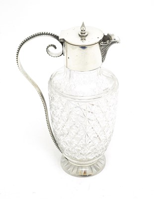Lot 159 - Silver mounted cut glass claret jug
