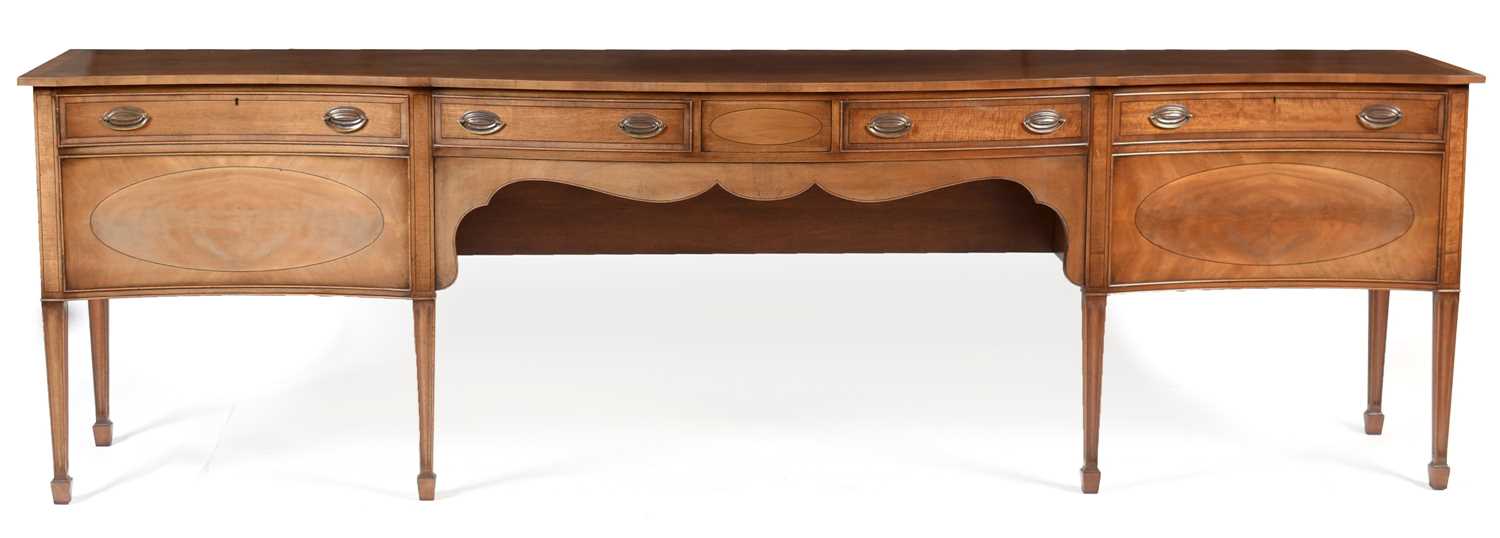 Lot 913 - Sheraton style mahogany serpentine sideboard