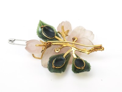 Lot 60 - A mid 20th C Austrian carved quartz and nephrite floral pattern brooch and earrings.
