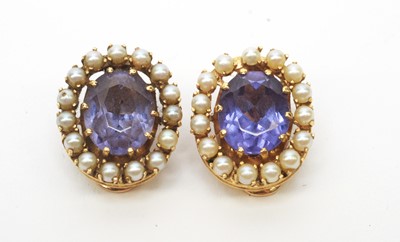 Lot 57 - A pair of synthetic colour change sapphire and pearl cluster earrings.