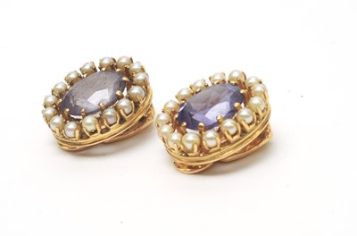 Lot 57 - A pair of synthetic colour change sapphire and pearl cluster earrings.