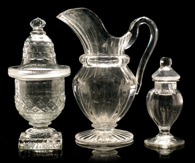 Lot 578 - Two glass jars and covers, cut glass jug.