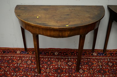 Lot 18 - Two 19th C mahogany demi lune side tables.