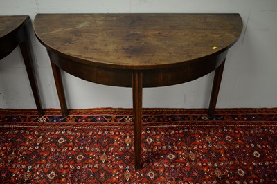 Lot 18 - Two 19th C mahogany demi lune side tables.
