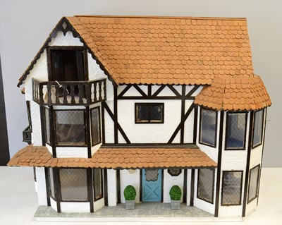 Lot 962 - A three-storey half-timbered doll's house.