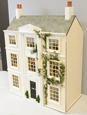 Lot 963 - A three-storey doll's townhouse.