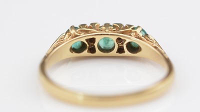 Lot 309 - Emerald and diamond ring.