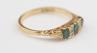 Lot 309 - Emerald and diamond ring.