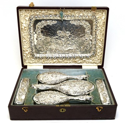 Lot 136 - An Edwardian cased silver dressing table set