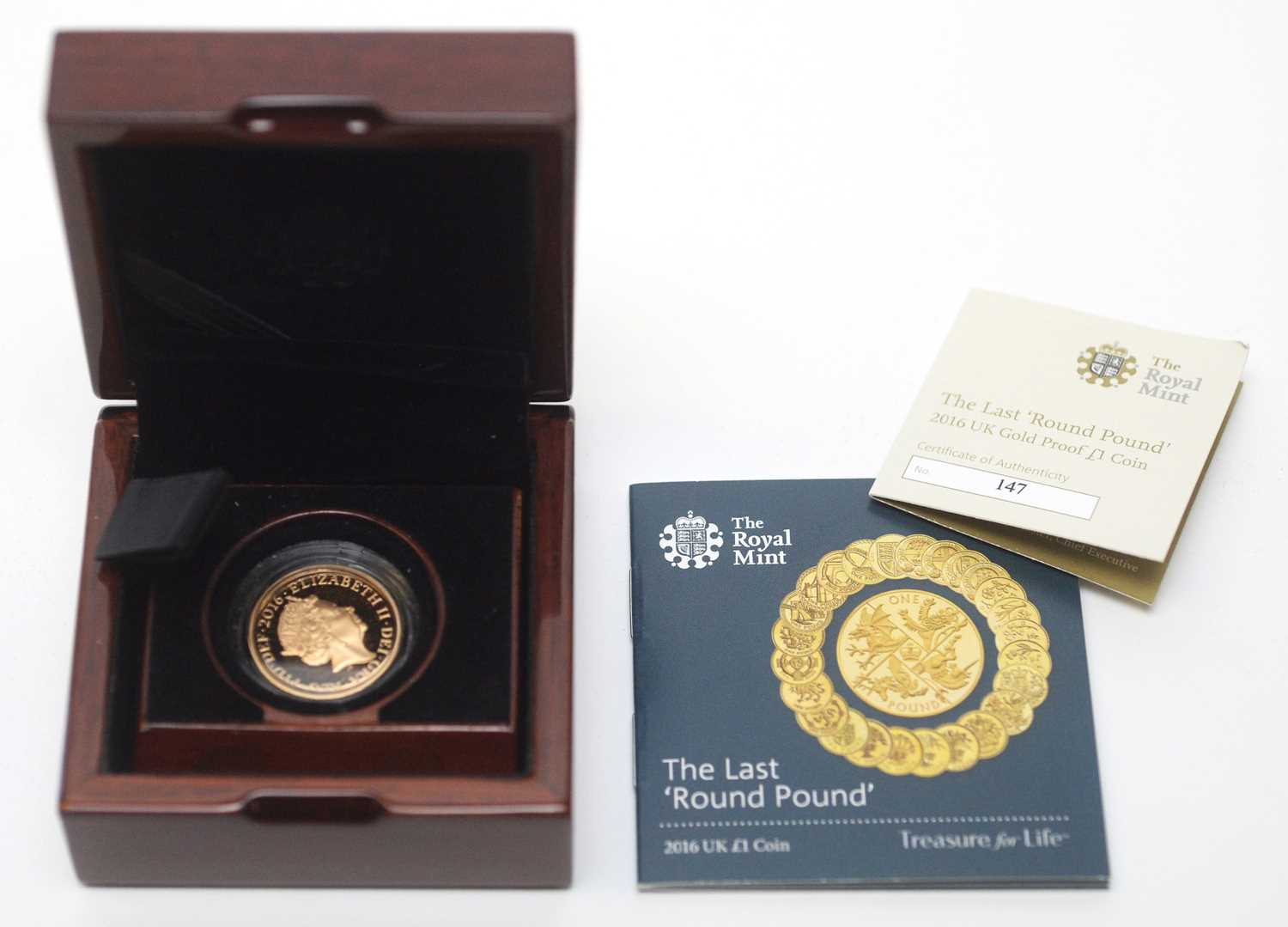 Lot 20 - The Last 'Round Pound', issued by The Royal Mint in 2016 as a £1 22ct gold proof coin