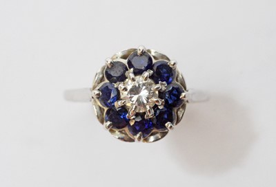 Lot 35 - A sapphire and diamond cluster ring