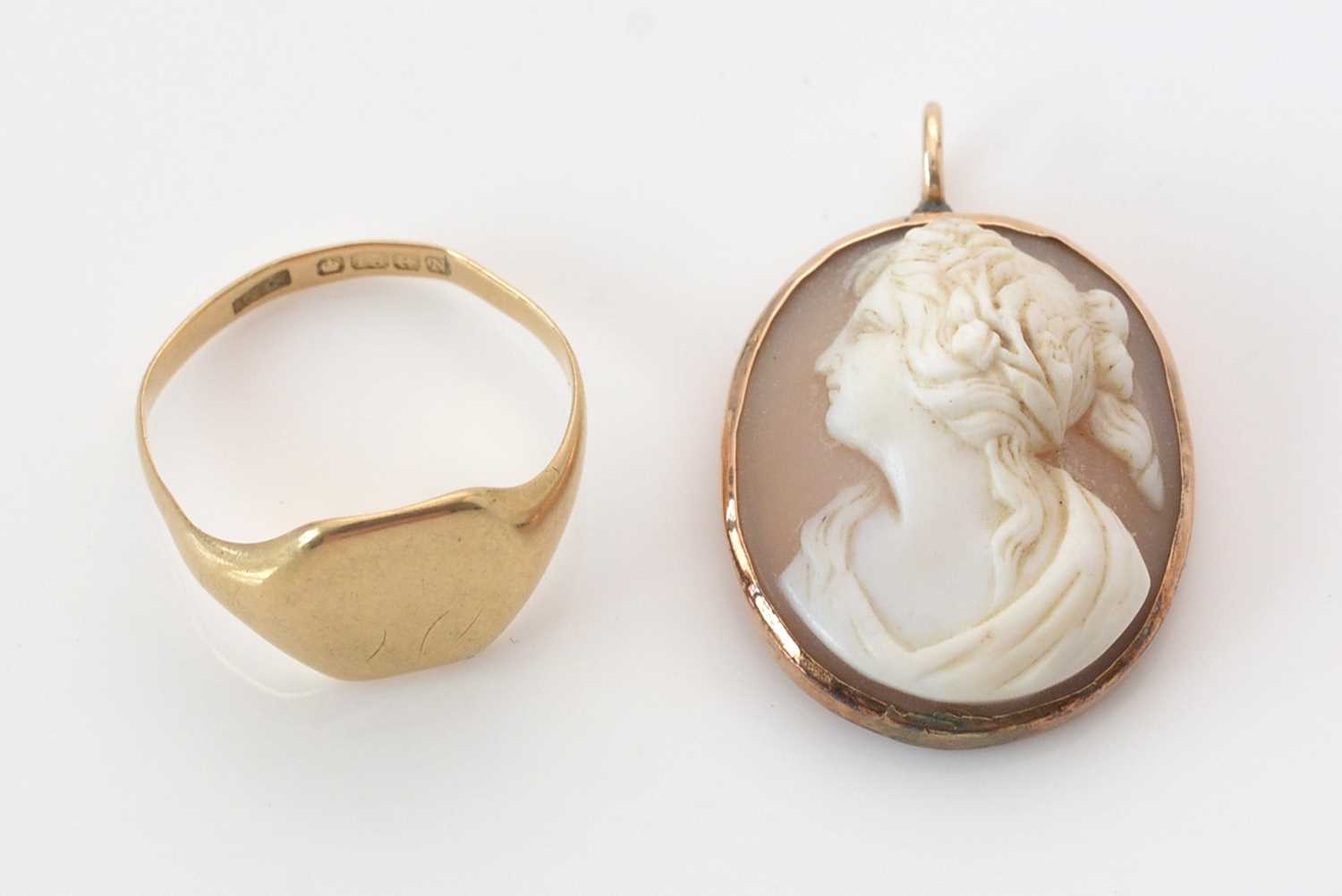 Lot 295 - 18ct. yellow gold signet ring; and a carved shell Cameo.